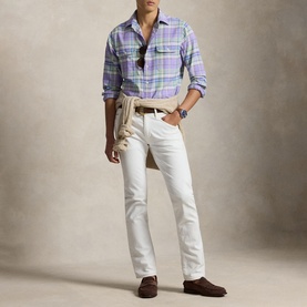 Model wearing Ralph Lauren lavender and green multi plaid regular shirt, styled with white jeans, tan belt, and brown loafers.