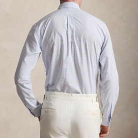 Model wearing Ralph Lauren Reg Shirt in Cabana Blue and White micro-check, back view, styled with cream trousers
