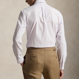 Model wearing Ralph Lauren Reg Shirt in powder purple and white stripe, styled with tan tailored trousers, rear view shown.