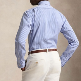 Model wearing Ralph Lauren blue stripe regular fit shirt, back view, styled with cream chinos and brown leather belt.
