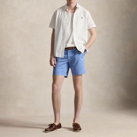 Model wearing Ralph Lauren Bristol Blue shorts with white short-sleeve shirt, brown belt and tan loafers.