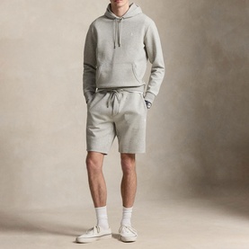 Model wearing Ralph Lauren Dark Sportheather sweat shorts styled with matching hoodie, white socks and white trainers.