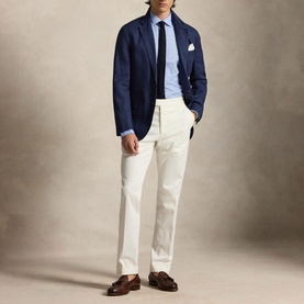 Model wearing Ralph Lauren Glen Plaid Poplin Shirt in Harbour Island Blue, styled with navy blazer, white trousers and brown loafers.
