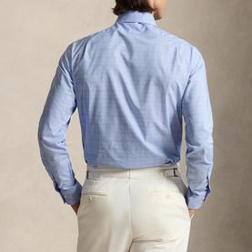 Model wearing Ralph Lauren Glen Plaid Poplin Shirt in Harbour Island Blue, back view, paired with cream tailored trousers.