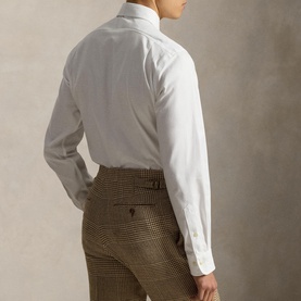 Model wearing Ralph Lauren white single cuff regular shirt, rear view, styled with brown houndstooth trousers