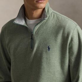Model wearing Ralph Lauren green quarter-zip sweatshirt with contrast grey collar, embroidered polo pony logo on chest