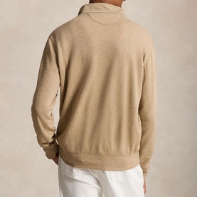 Model wearing Ralph Lauren Polo Player Half-Zip Pullover in Warm Brown Heather, back view, styled with white trousers
