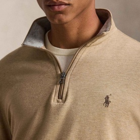 Model wearing Ralph Lauren Polo Player Half-Zip Pullover in Warm Brown Heather with mockneck, quarter-zip placket and embroidered pony logo