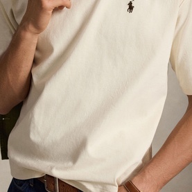 Model wearing Ralph Lauren T-Shirt in Guided Cream with embroidered polo pony logo at chest.