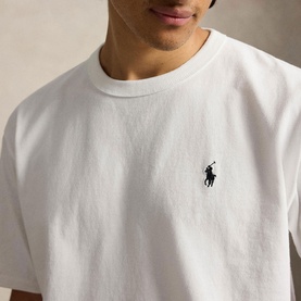 Model wearing Ralph Lauren white T-shirt with embroidered Polo Pony logo at chest, crew neck, relaxed fit