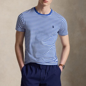 Model wearing Ralph Lauren T-Shirt in New Iris Blue and White horizontal stripes, crew neck, with navy shorts and brown watch.