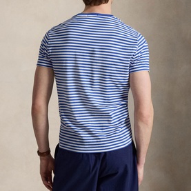 Model wearing Ralph Lauren striped T-shirt in New Iris Blue and White, rear view, styled with navy shorts
