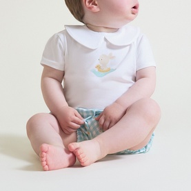 Baby model wearing Street Monkey white/turquoise 2-piece set with duck motif collar top and patterned shorts