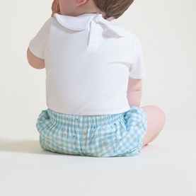 Street Monkey baby 2-piece set in white and turquoise gingham, shown from behind on seated baby