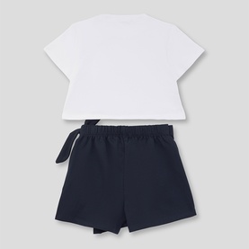 Street Monkey white/navy 2-piece set, back view showing white short-sleeve top with tie detail and navy elasticated shorts