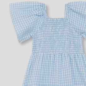 Street Monkey blue gingham smocked dress with flutter sleeves, close-up detail of shirred bodice