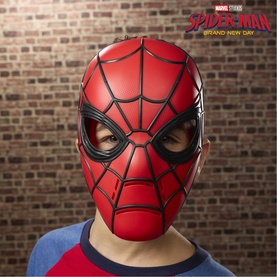 Child wearing Superheroes Spider-Man red and black plastic face mask, shown against a brick wall background with Marvel branding visible