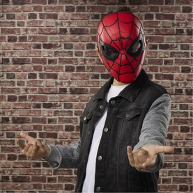 Model wearing Superheroes Spider-Man Wisecrackin' Glow Mask in red and black, styled with denim vest over white tee, hands outstretched