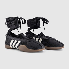 Adidas black floral trainers with off-white three stripes, ankle wrap ribbon laces, and gum sole, pair view