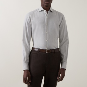 Model wearing Gherardi grey cotton cashmere casual shirt with spread collar, styled with dark brown trousers and leather belt.