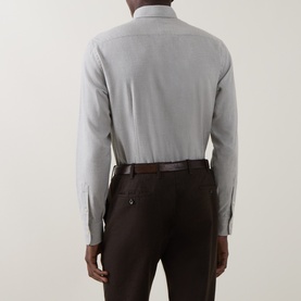 Model wearing Gherardi grey cotton-cashmere casual shirt, rear view, styled with dark brown trousers and leather belt.