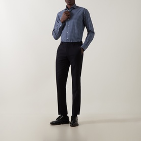 Model wearing Gherardi navy cotton casual shirt with small check pattern, styled with black tailored trousers and black leather shoes.