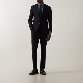 Model wearing Gherardi navy casual shirt styled with dark suit, tie, and black leather dress shoes