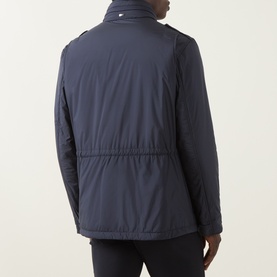 Model wearing Herno navy casual jacket, back view, with cinched waist, epaulettes, and high collar detail