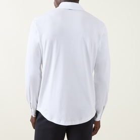 Model wearing Herno white cotton casual shirt, rear view, long sleeves with button cuffs, worn with dark trousers