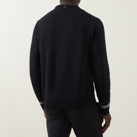Model wearing Herno Contrast Stripe Sweater in dark blue, crew neck, long sleeves, ribbed cuffs with contrast stripe trim, back view.
