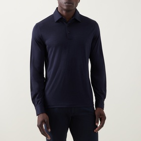 Model wearing Herno Jersey Long-Sleeved Polo Shirt in navy blue, with polo collar and button fastenings, styled with navy trousers.