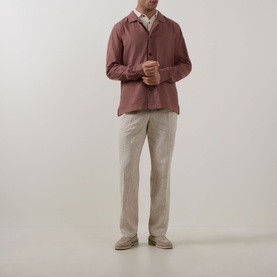 Model wearing Profuomo Clay Garment-Dyed Overshirt with pointed collar and button fastenings, styled with beige trousers and loafers