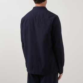 Model wearing Profuomo Garment-Dyed Overshirt in navy, rear view showing long sleeves and straight hemline, linen-cotton blend