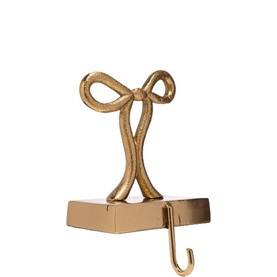 Vondels Gold Bow Stocking Hanger 18cm in gold-finish brass, featuring a decorative bow detail on a rectangular base with hook.