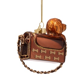 Vondels brown glass dog carrier tree decoration with golden bone details, chain strap, and fluffy dog peeking out, hung on gold thread