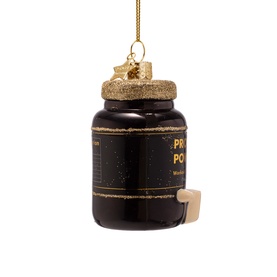 Black and gold glass protein powder tub Christmas tree ornament with gold hanging thread and cork-style stopper detail.