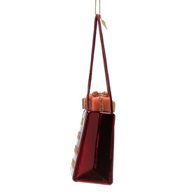 Deep red glass handbag Christmas tree ornament with gold buckle detail, hanging on a cord