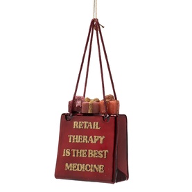 Red glitter Christmas tree ornament shaped as a shopping bag reading "Retail Therapy Is The Best Medicine" with miniature gift bags inside