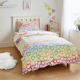 Catherine Lansfield Rainbow Hearts Duvet Set Pink, single bed styled with matching heart wall stickers in a children's bedroom