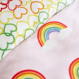 Catherine Lansfield Rainbow Hearts Duvet Set Pink, close-up of pink rainbow print and white multicolour heart print fabric panels