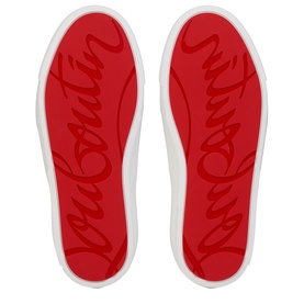 Christian Louboutin shoe soles in red with embossed Louboutin script branding and white rubber edge trim.