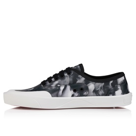 Christian Louboutin black and white marbled print low-top lace-up sneaker with white flatform sole and red undersole detail