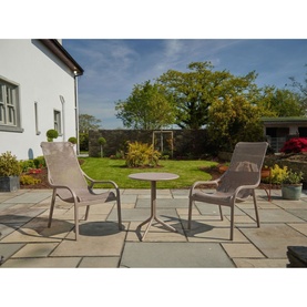 Caseys Furniture Net Garden Lounge Set Tortora in grey, two high-back chairs and round bistro table on stone patio with garden backdrop