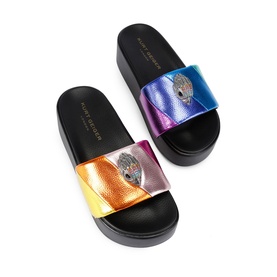 Kurt Geiger London Meena Eagle Head Platform Slides in multi rainbow metallic with silver eagle head embellishment and black platform sole