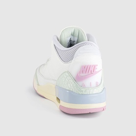 Nike Air Jordan 3 trainer in white with pastel pink, mint, and blue accents, pink Swoosh logo, cream midsole, rear three-quarter view