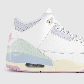 Air Jordan 3 trainer in white with pastel pink, mint and lavender accents, gold eyelets, visible Air unit, and textured midsole detail