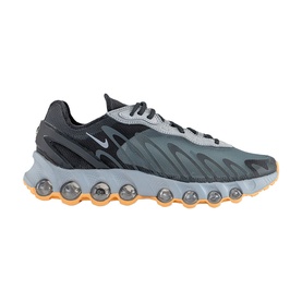 Nike men's trainer in cool grey, featuring textured upper, black accents, bubble-effect midsole, and orange-tinted outsole pods.