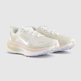 Nike trainers in Summit White with iridescent Swoosh, cream midsole and pale lavender outsole, displayed as a pair at an angle