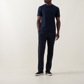 Model wearing Boss Black Casual H-Thompson318 Dark Blue tonal stripe crew neck T-shirt with navy trousers and grey trainers.