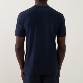 Model wearing Boss Black Casual H-Thompson318 Tonal Stripe T-Shirt in dark blue, back view showing vertical stripes and straight hemline.